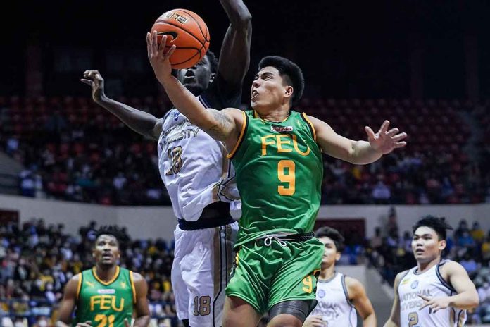 Ilonggo John Bryan Sajonia of Far Eastern University Tamaraws bravely attacks the defense of National University Bulldogs center Omar John for a layup. UAAP MEDIA BUREAU PHOTO