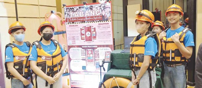 Photo shows Tabang emergency assistance mobile app creators Devine Grace Acurantes, Ysha Sam Alejega, John Kenneth Fernardo, Vina Mae Jocsing, and Raymond Saenz of Dumolog National High School in Roxas City during the TCS goIT Digital Innovation Fair 2022 in Iloilo City. GLENDA TAYONA/PN