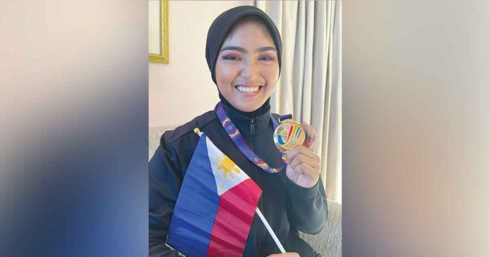 Mary Francine Padios of Kalibo, Aklan is a Hanoi Southeast Asian Games gold medal winner in pencak silat. CONTRIBUTED PHOTO