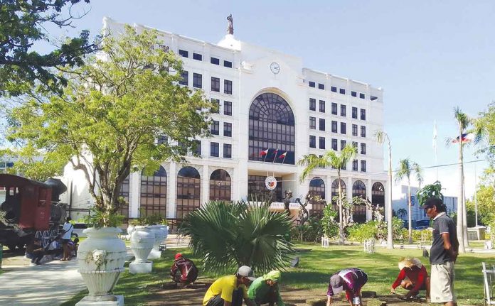 Iloilo City’s Mayor Jerry P. Treñas on Monday, Nov. 28, reminded city hall employees of their respective tasks that must have unity of purpose, sense of urgency and accelerated implementation. “We will be more accessible to everyone,” he added. Photo shows city hall personnel working on landscaping at the vacant portions of Plaza Libertad, fronting the Iloilo City Hall. ILOILO CITY PIO PHOTO