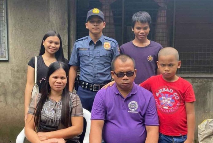 Photo shows the 24-year-old patrolman, Val Liansing, with his family members who are all visually impaired. Liansing died on Sunday, Oct. 30, after he accidentally shot himself in their house in Barangay Mansilingan, Bacolod City. DSWD PHOTO