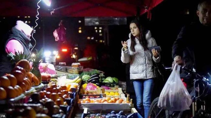 Kyiv's residents are having to improvise during frequent blackouts - like at this street market.