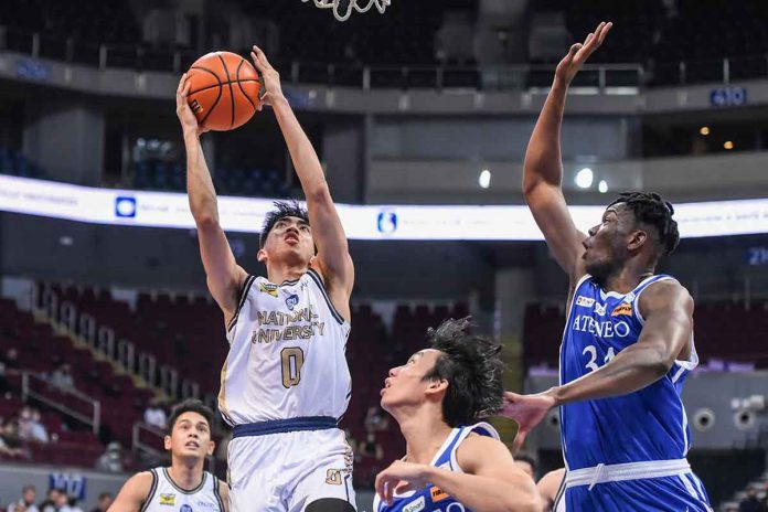 National University Bulldogs’ Jolo Manansala goes for an inside hit as Ateneo de Manila University Blue Eagles’ Angelo Kouame attempts for a block. UAAP PHOTO