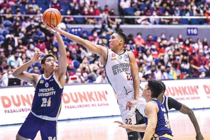 University of the Philippines Fighting Maroons' Zavier Lucero stretches for a layup. UAAP PHOTO