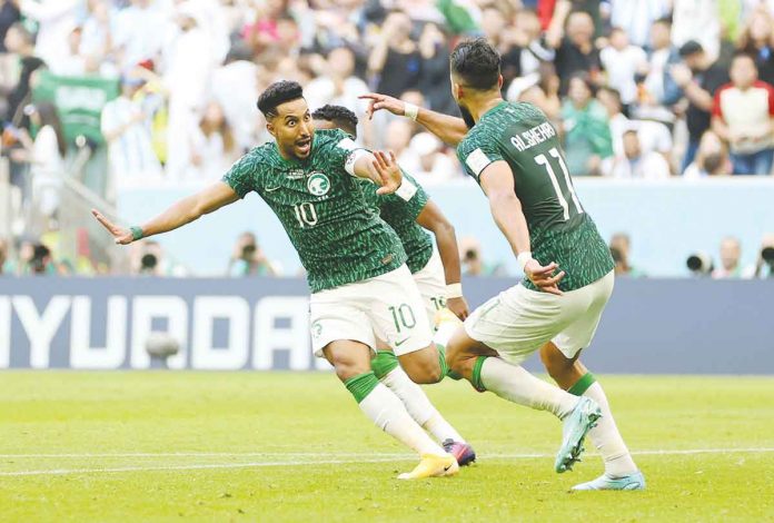 Salem Al-Dawsari celebrates after scoring Saudi Arabia's second goal. CLIVE BRUNSKILL/GETTY IMAGES