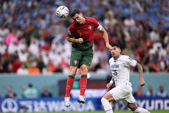 Portugal’s Cristiano Ronaldo jumps up to head the ball during a match against Uruguay. KIRILL KUDRYAVTSEV/AFP VIA GETTY IMAGES