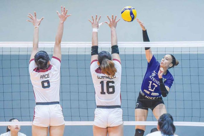 Ateneo de Manila University Blue Eagles’ Faith Nisperos goes for an attack against University of the Philippines Fighting Maroons’ Stephanie Bustrillo. V-LEAGUE PHOTO