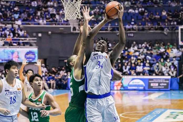 Ateneo de Manila University Blue Eagles’ Angelo Kouame attempts an inside shot against the defense of De La Salle University Green Archers’ Michael Phillips. UAAP PHOTO