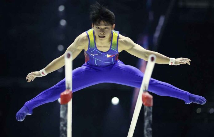 Carlos Yulo performs during the men’s parallel bars finale of the 51st FIG Artistic Gymnastics World Championships on Sunday night in Liverpool, Great Britain. PHOTO COURTESY OF PHIL NOBLE/REUTERS