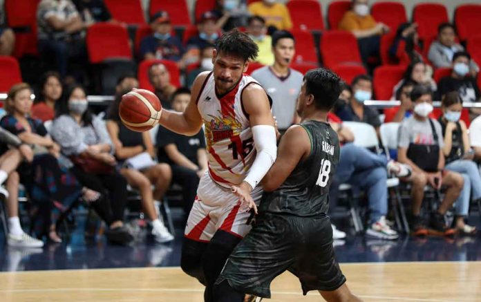 San Miguel Beermen’s June Mar Fajardo tries to ward off the defense of Terrafirma Dyip center Joseph Gabayni. PBA MEDIA BUREAU PHOTO