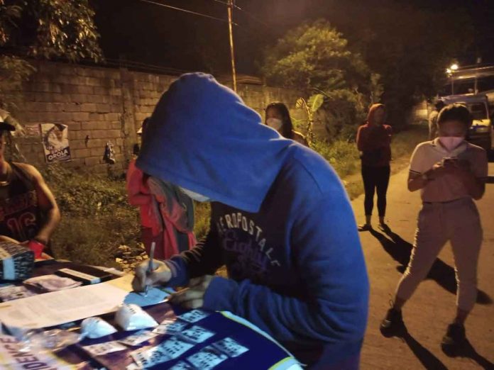 Drug suspects Barangay Alijis kagawad Abby Araneta and her driver, Freely Boy Aldas, yielded two knot-tied and 13 plastic sachets of suspected shabu weighing 201 grams and valued at P1,366,800 on Tuesday, Nov. 8. BACOLOD CITY POLICE OFFICE PIO PHOTO