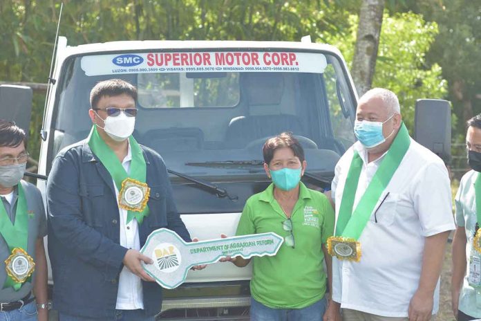 Undersecretary Jesry Palmares of the Department of Agrarian Reform is with Gov. Joaquin Carlos Rahman Nava of Guimaras during the turnover of two farm projects to two Agrarian Reform Beneficiaries' Organizations on Dec. 21, 2022. DAR–GUIMARAS FACEBOOK PAGE