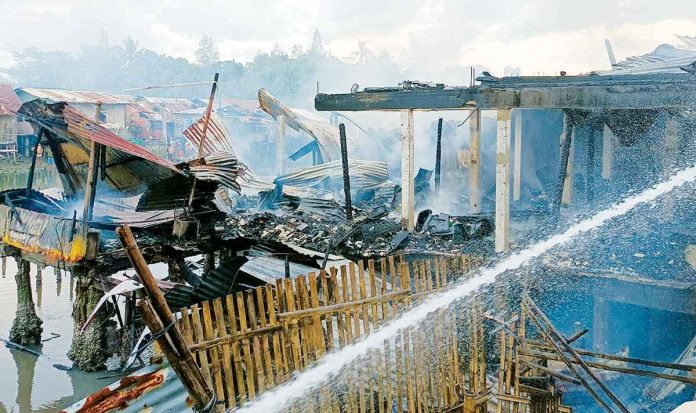 Fire gutted 12 houses in Barangay Compania, Molo, Iloilo City on Tuesday afternoon, Dec. 20, 2022. Residents heard three loud explosions before the fire broke out. Authorities are still determining the cause of the fire and the total value of the damaged properties. AJ PALCULLO/PN