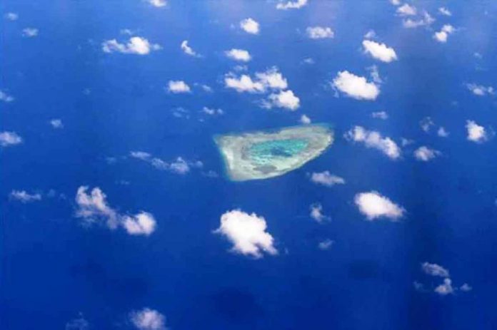 This picture taken on April 21, 2017, shows an aerial view of a reef in the disputed Spratly islands. PHOTO BY TED ALJIBE / AFP