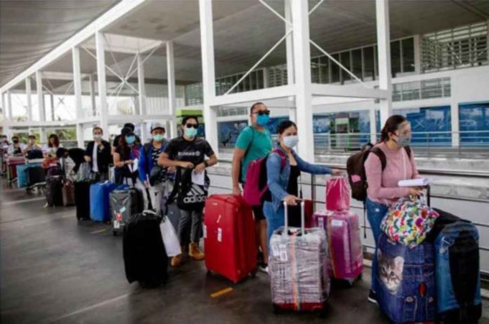 Repatriated overseas Filipino workers arrive at an airport after being allowed to go home following weeks of quarantine amid the spread of the coronavirus disease, in Pasay City, Metro Manila. FILE PHOTO BY ELOISA LOPEZ / REUTERS