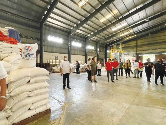 PRESIDENT Ferdinand "Bongbong" Marcos Jr. conducts a surprise inspection of the National Food Authority warehouse in Valenzuela City on Dec. 17, 2022. @MAVGONZALES TWITTER PHOTO