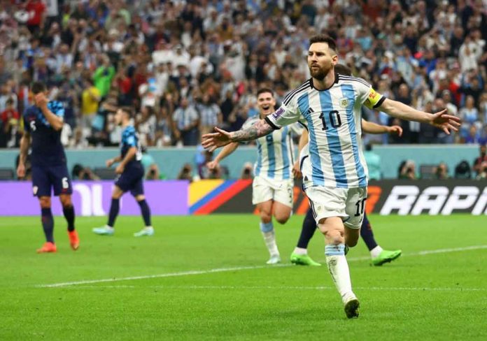 Lionel Messi celebrates after scoring Argentina’s first goal from the penalty spot. CARL RECINE/REUTERS