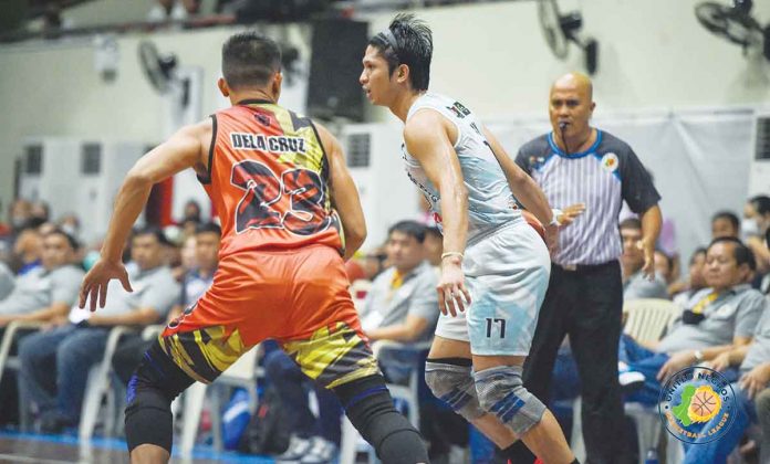 Acster Marketing’s Alwyn Alday dribbles the ball against a RA-AK Transport defender. PHOTO COURTESY OF STEPHEN TAN