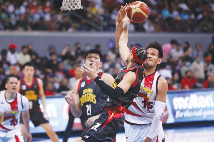 Bay Area Dragons’ Kobey Lam had his layup foiled by the defense of San Miguel Beermen center June Mar Fajardo. PBA PHOTO