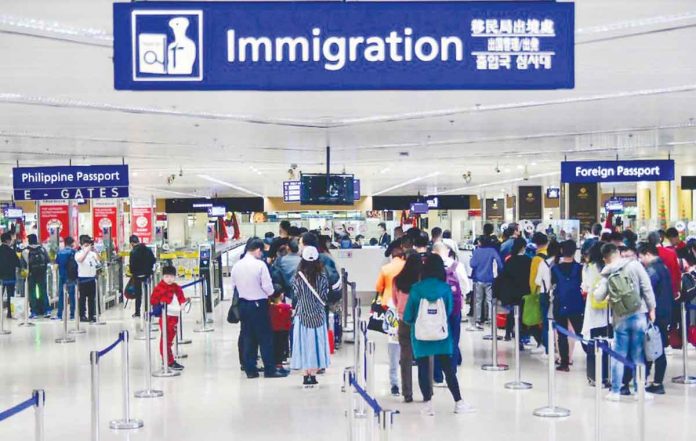 Foreign travelers reached 2,397,919 as of Dec. 15, 2022. Department of Tourism, meanwhile, seeks to attract 4.8 million visitors in 2023. Photo shows passengers arriving at the NAIA Terminal 1. MARK DEMAYO/ABS-CBN NEWS FILE PHOTO