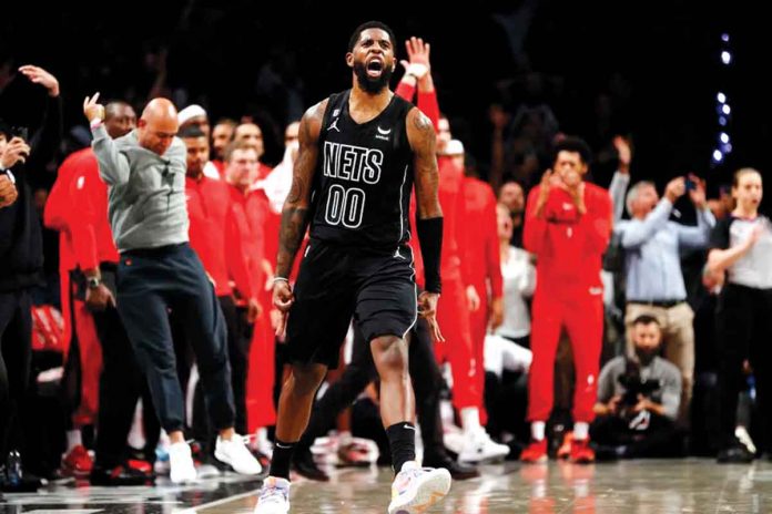 Royce O'Neale reacts after scoring the go-ahead basket for Brooklyn Nets against Miami Heat. GETTY IMAGES