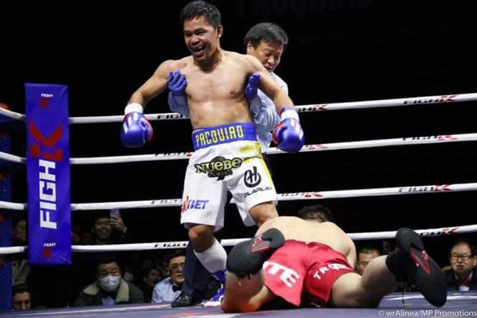 Retired Filipino boxer Manny Pacquiao knocks down South Korean Youtuber DK Yoo during an exhibition match in December 2022. PHOTO COURTESY OF WENDELL ALINEA/MP PROMOTIONS