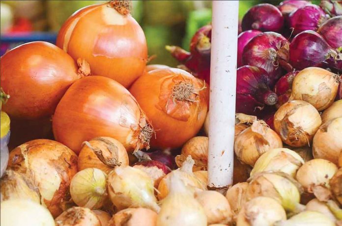 Onions go for sale in a market in Manila. MARK DEMAYO/ABS-CBN NEWS PHOTO