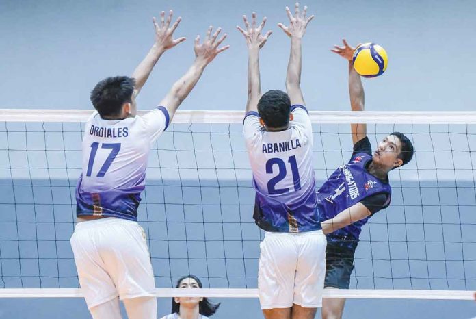 D’Navigators-Iloilo’s Jerome Cordez evades the defense of National University-Archipelago Builders Volley Builders’ Jan Abanilla for a drop shot. PHOTO COURTESY OF SPIKERS’ TURF