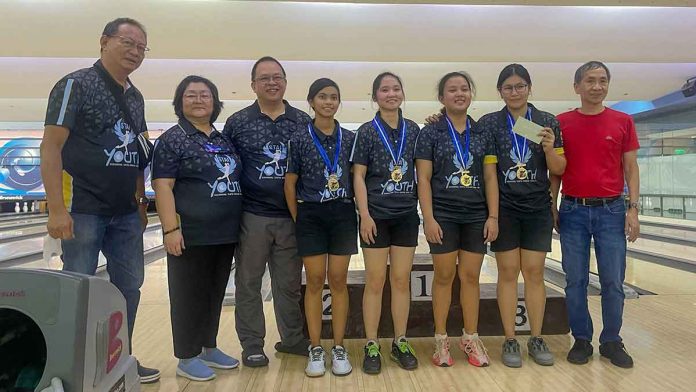 Bacolod City’s Sugar Bowl Tenpin Association Inc. coaches Ariel Yelo, Joyce Santos and Herman Santos, along with their champion players Nomie Rosario, Alyana Abelada, Antonnette Garcia and Tracey Tan and Philippine Bowling Federation president Ed Santos. CONTRIBUTED PHOTO