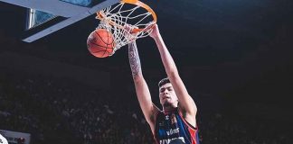 Kai Sotto of the Adelaide 36ers with a two-handed dunk. NBL PHOTO