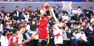 Barangay Ginebra San Miguel Kings’ Stanley Pringle fires a corner triple over the defense of Bay Area Dragons’ Kobey Lam. PBA PHOTO