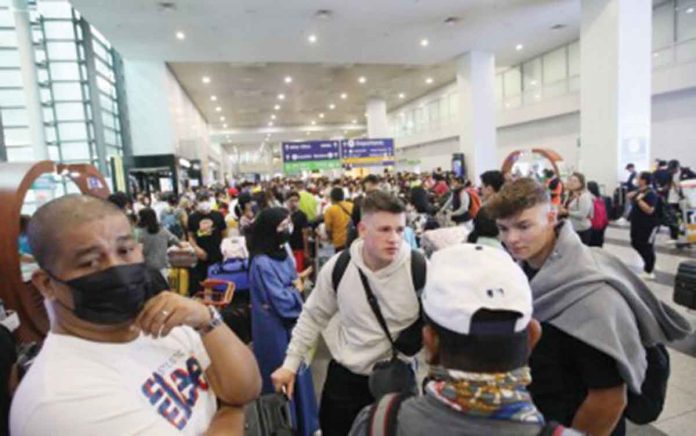 Returning Filipinos and foreign tourists arrive at the Ninoy Aquino International Airport Terminal 3. The Department of Tourism targets to welcome 4.8 million visitors this year that could generate about P2.58 trillion in revenues. PNA PHOTO BY AVITO DALAN