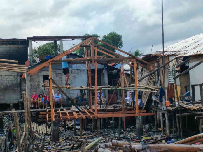 Fire victims from barangays West Habog-Habog and San Juan in Molo, Iloilo City went back to the fire site and started rebuilding their houses. AJ PALCULLO/PN