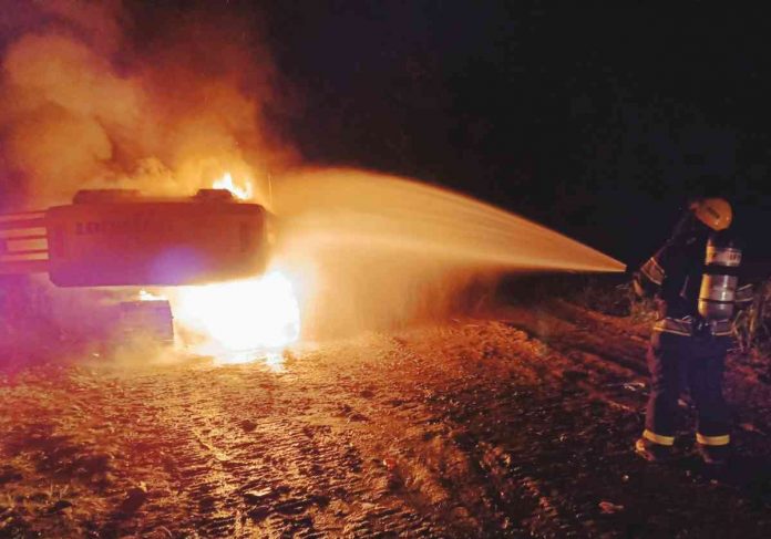 Fire personnel responded to an arson incident involving heavy equipment in Barangay Malingin, Bago City, Negros Occidental, on Saturday. BAGO CITY FIRE STATION