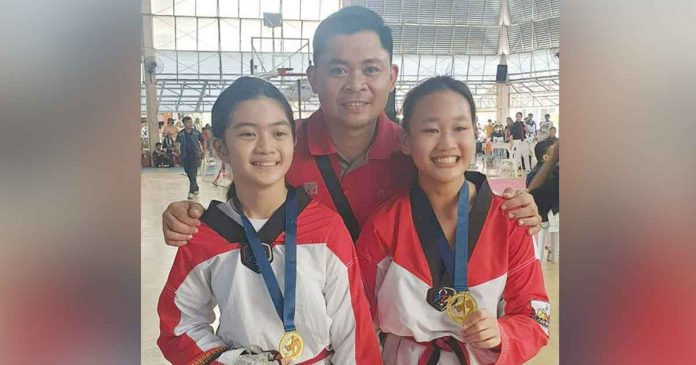 Iloilo MVP Taekwondo Gym head coach Denmark Pinggol with two of his taekwondo jins. PHOTO COURTESY OF DENMARK PINGGOL