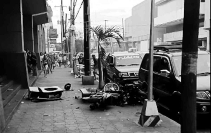 Two motorcycles fell from a mall's second-floor car park on Saturday. SCREENGRAB FROM JOHN MAGO FB VIDEO