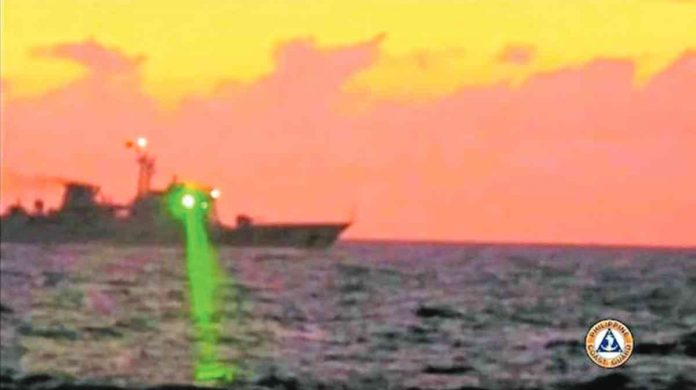 NEW TACTIC. China Coast Guard Vessel No. 5205 is shown directing a laser beam at BRP Malapascua where this photo was taken on Feb. 6, 2023. PHOTO FROM THE PHILIPPINE COAST GUARD