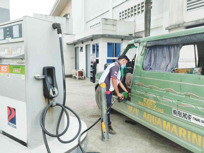 A passenger jeepney queues for fuel at Petron gasoline station in Pavia, Iloilo. PN PHOTO