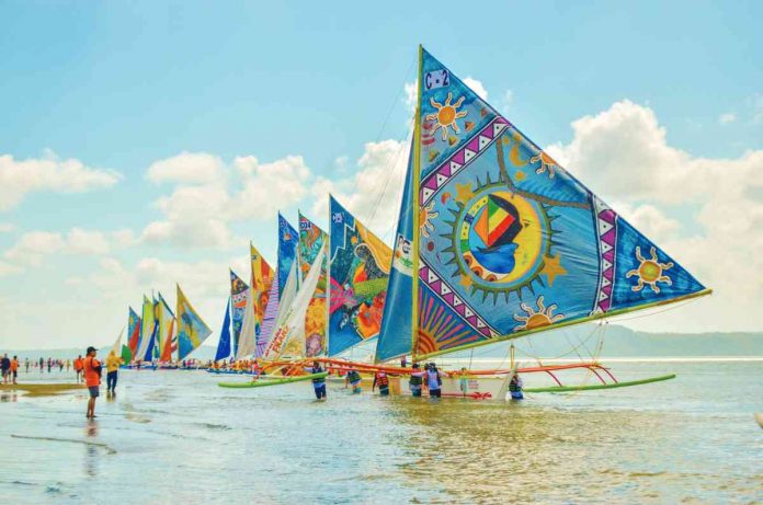 Colorful paraws are seen along the shoreline of Villa Beach in Arevalo, Iloilo City during the 47th Paraw Regatta Festival main sailing event in 2019. The largest sailing event in the Philippines will be back for its 50th year from March 12 to 19, 2023. PN FILE PHOTO