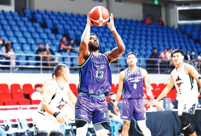 Maverick Ahanmisi anchors Converge FiberXers’ victory over Blackwater Bossing. PBA PHOTO