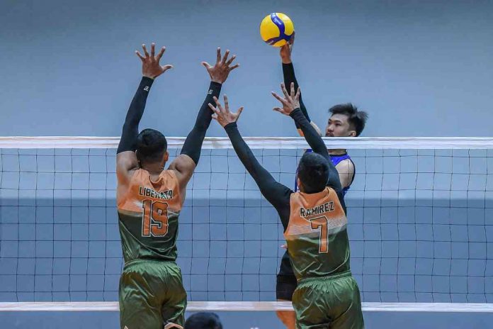 D’Navigators-Iloilo’s Jade Disqutado attempts a drop shot against two Philippine Army Troopers defenders. PHOTO COURTESY OF SPIKERS’ TURF