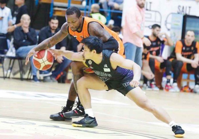 Strong Group-Philippines' JD Cagulangan attempts to steal the ball from an Al Wahda-Syria player. PHOTO COURTESY OF UAE BASKETBALL