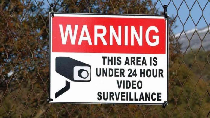 Sign warning areas is under 24 hour video surveillance. GETTY IMAGES