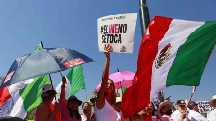 Many Mexican protesters – like on this photo from Guadalajara – carried slogans that read in Spanish: “Do not touch the INE”. EPA