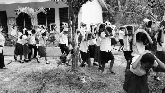 Students at Hoskyn Elementary School in Jordan town were again refreshed on what to do in the event of an earthquake through a drill conducted by the Guimaras Disaster Risk Reduction and Management Office. PROVINCE OF GUIMARAS