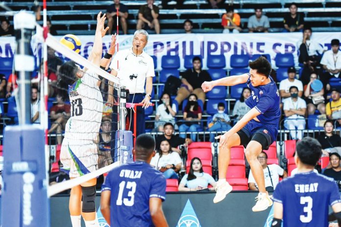 D’Navigators-Iloilo’s Jade Disquitado hammers the ball towards a Imus-Ivy Tuazon Photography AJAA Spikers’ defender. PHOTO COURTESY OF SPIKERS’ TURF