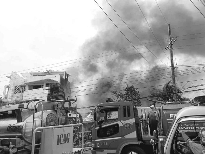 Fourteen houses were gutted in a fire in Barangay Rizal, Lapuz, Iloilo City on Saturday morning, March 18. The Bureau of Fire Protection said the fire was caused by faulty electrical wiring. AJ PALCULLO/PN