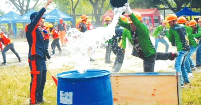 Volunteers from community fire auxiliary groups compete in the 1st Mayor Albee Benitez Barangay Fire Olympics on Friday, March 24. BACOLOD CITY PIO PHOTO