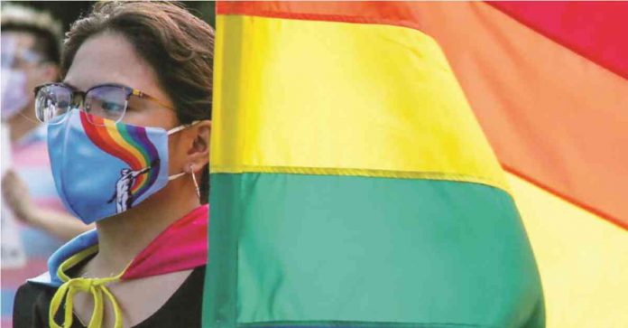 Members of the LGBT community carry rainbow flags and shout slogans during the UP Pride March in UP Diliman. JONATHAN CELLONA, ABS-CBN NEWS/FILE PHOTO