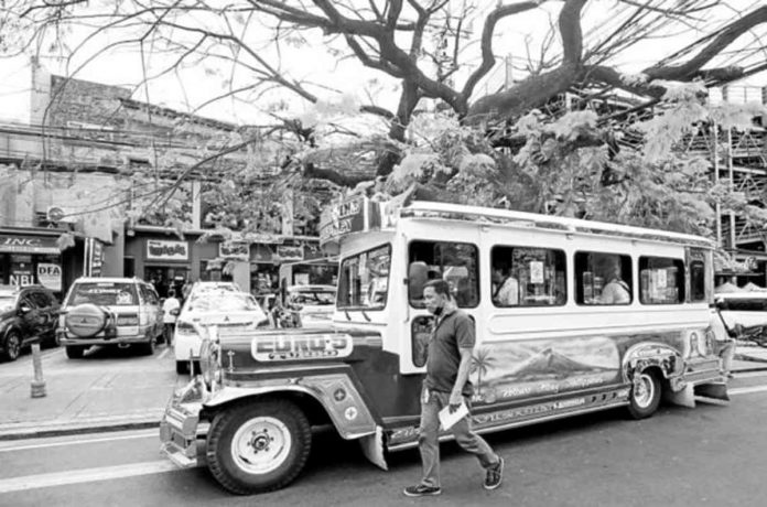 MIX OF OLD AND NEW. This vehicle retains the traditional look of the jeepney but is equipped with a modern engine and other features. The Land Transportation Franchising and Regulatory Board has approved this prototype for the modern jeepney, as presented by the Association of Committed Transport Organizations Nationwide Corp. PHOTO BY LYN RILLON /PHILIPPINE DAILY INQUIRER